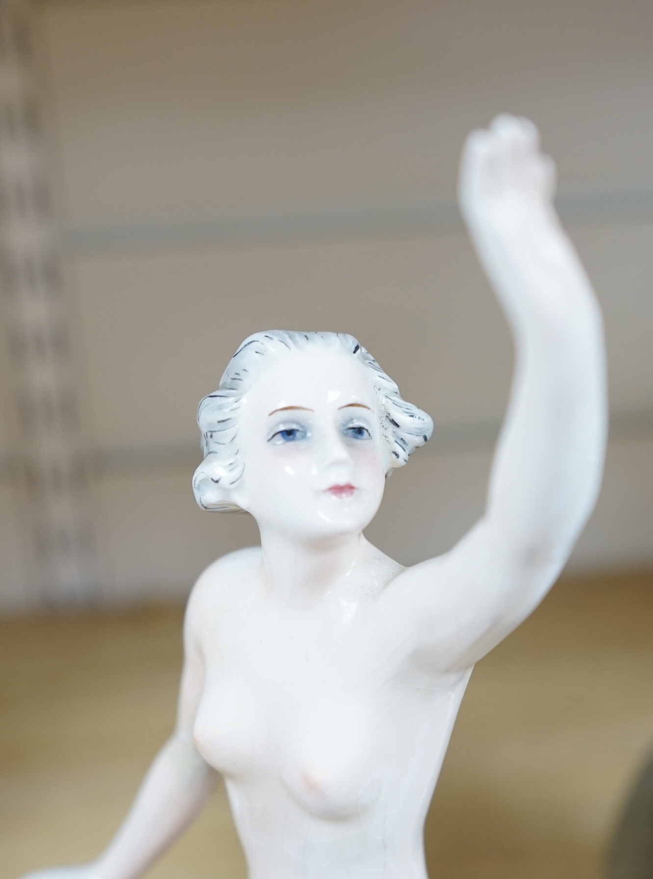 An Art Deco figural nude woman by Goebel, Oeslau Wilhelmsfield, 30cm high. Condition - restored